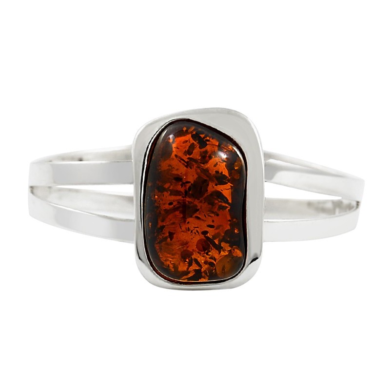 Bransoletka wykonana całkowicie ze srebra 925 z dużym bursztynem w ciemnym koniakowym kolorze.