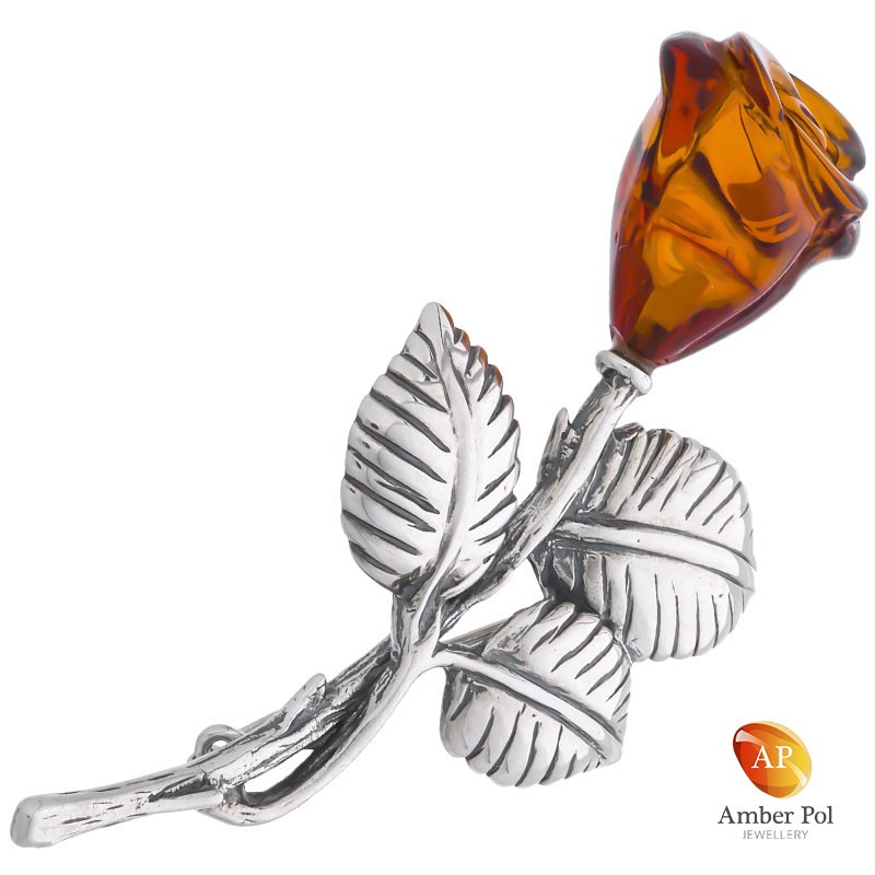 Broszka srebrna 925 z bursztynem oszlifowanym w kwiat róży, na łodyżce srebrnej z trzema listkami.
