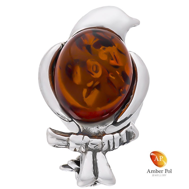 Broszka srebrna 925 o kształcie ptaszka na gałązce z bursztynem w kolorze koniaku.