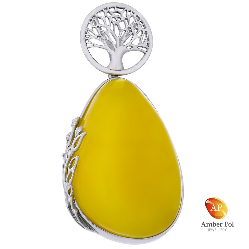 Wisior srebrny 925 z pięknym  mlecznym bursztynem wkomponowanym w stylową oprawę z ażurowymi zdobieniami.