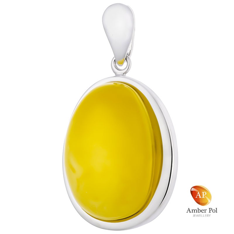 Unikatowy wisior srebrny 925 z pięknym białym bursztynem całkowicie oprawionym ręcznie w stylowej eleganckiej wersji.