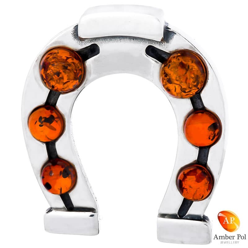 Wisiorek ze srebra 925 w kształcie podkowy  z sześcioma bursztynkami w kolorze koniaku.
