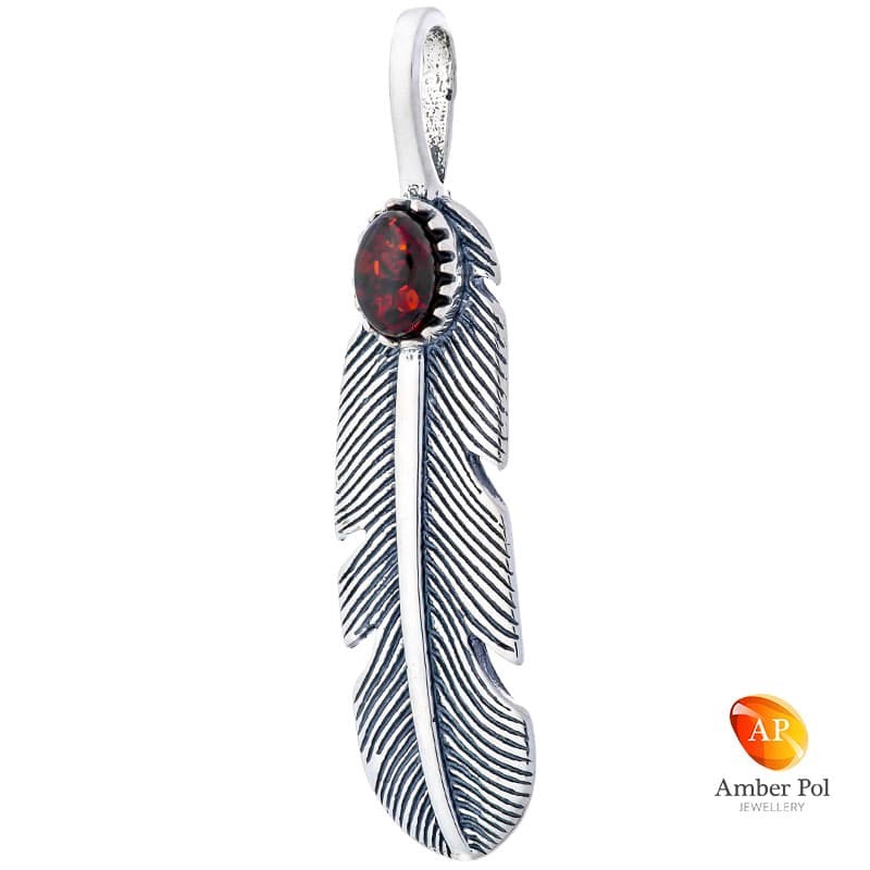 Piękny wisiorek w ze srebra 925 w kształcie piórka z bursztynem w kolorze koniakowym.