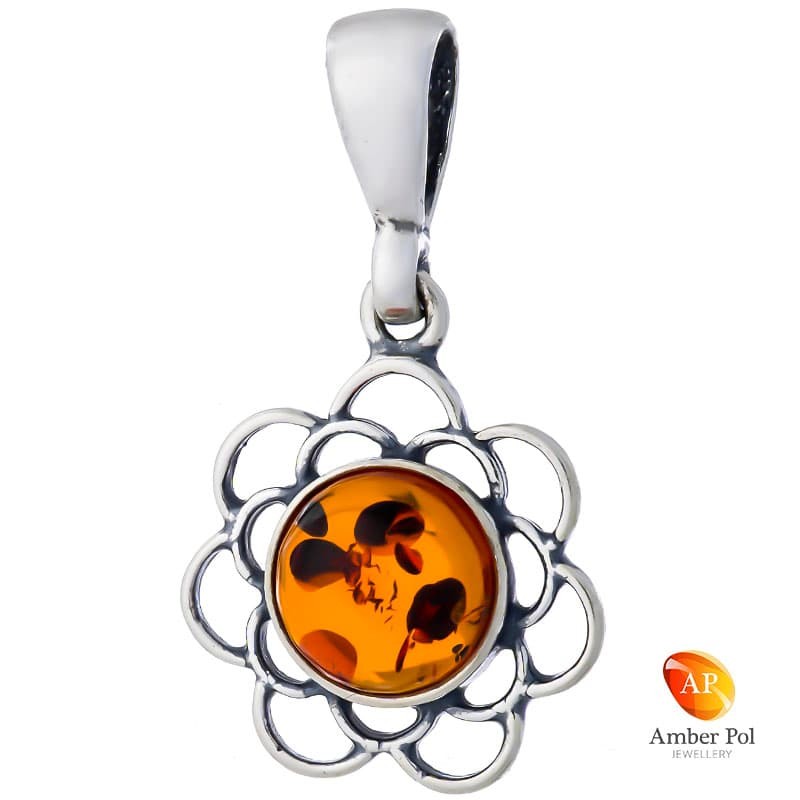 Piękny wisiorek ze srebra 925 z okrągłym bursztynem w kolorze koniakowym. posiada zdobienia w kształcie falbanek.