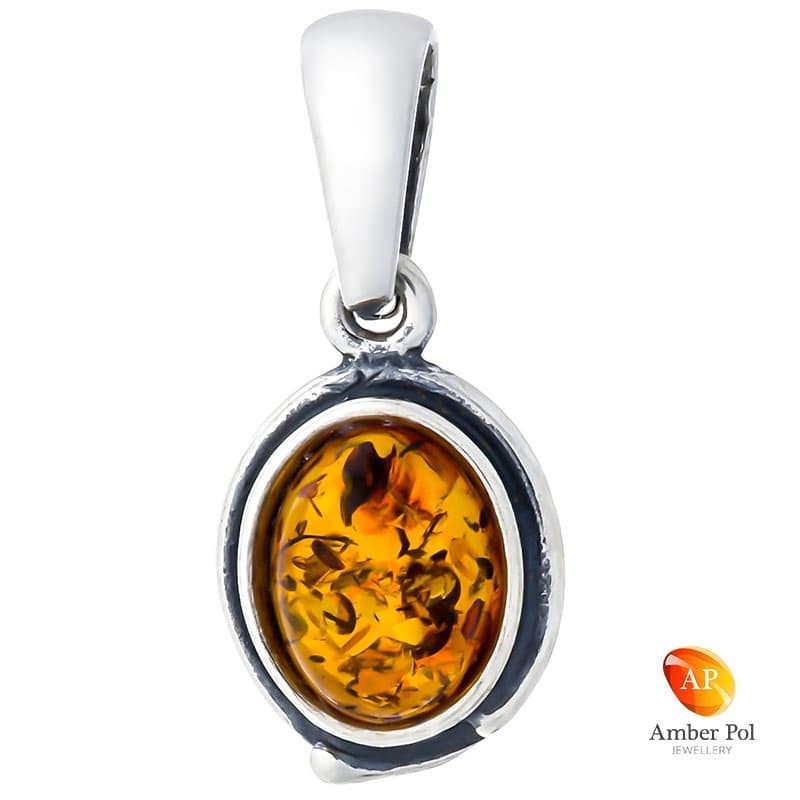 Piękny wisiorek ze srebra próby 925 z bursztynem w kolorze koniakowym i delikatnymi  zdobieniami .