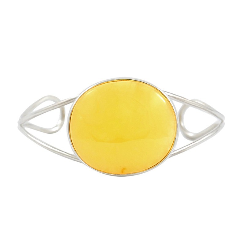 Unikatowa bransoletka wykonana ze srebra próby 925 z dużym naturalnym bursztynem w mlecznym kolorze.