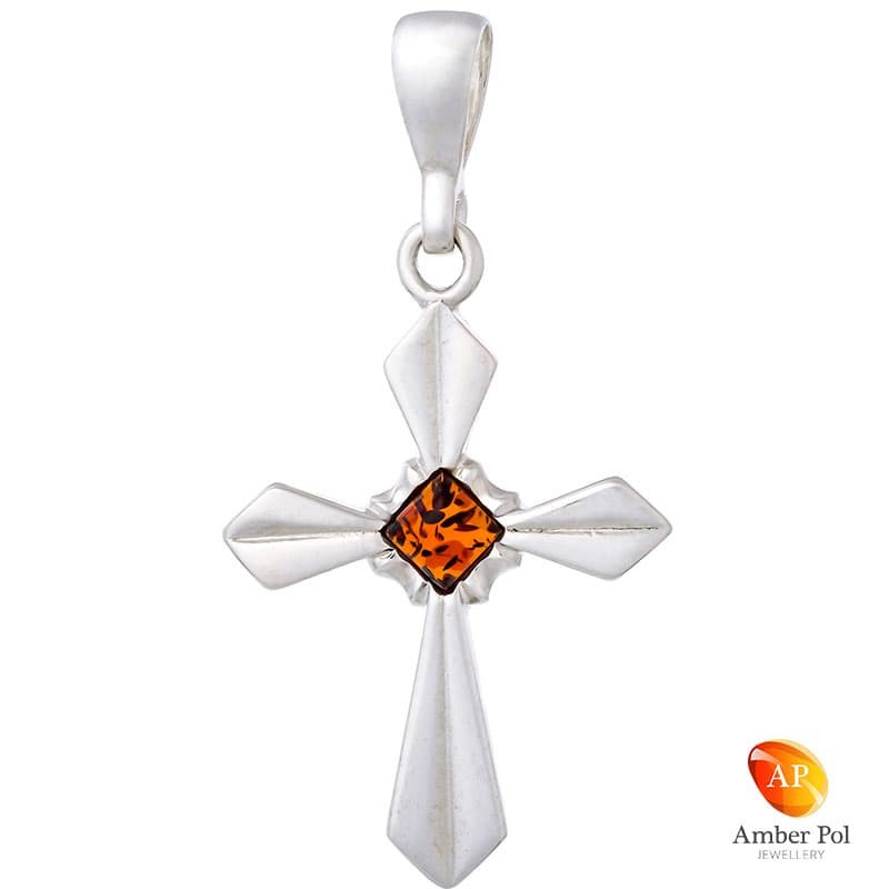 Piękny wisiorek ze srebra próby 925 przedstawiający krzyżyk z kwadratowym, koniakowym bursztynem po środku  wyrobu.