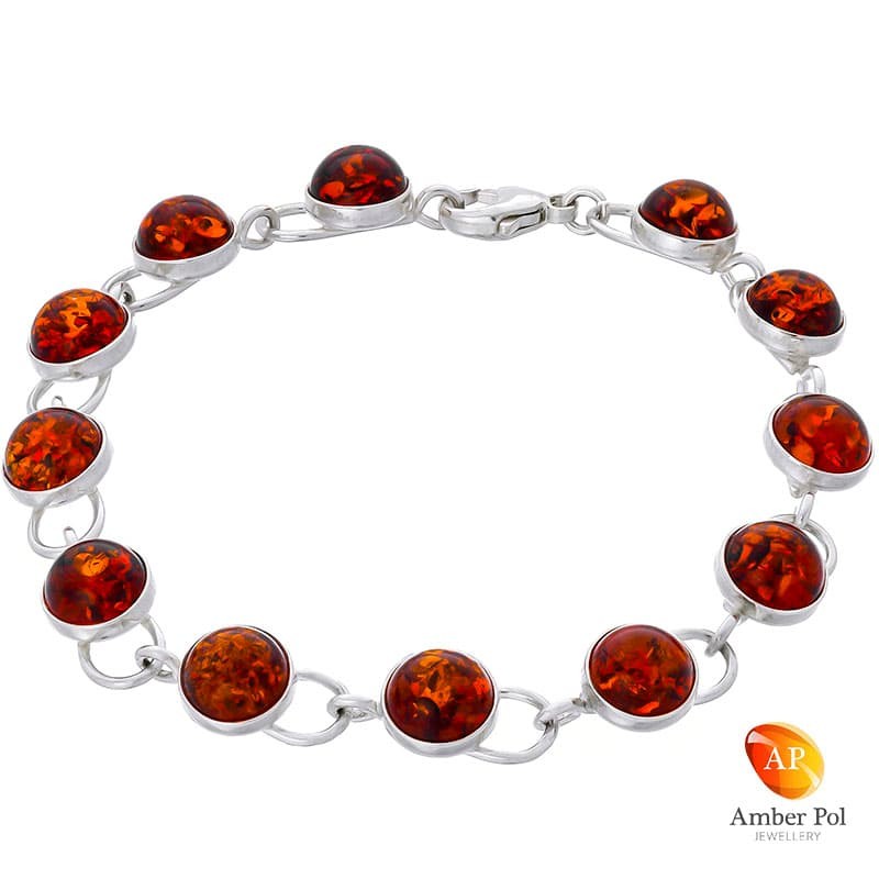 Piękna bransoletka srebrna próby 925 z 12 elementami i bursztynami w kolorze koniakowym  ręcznie zakutymi.