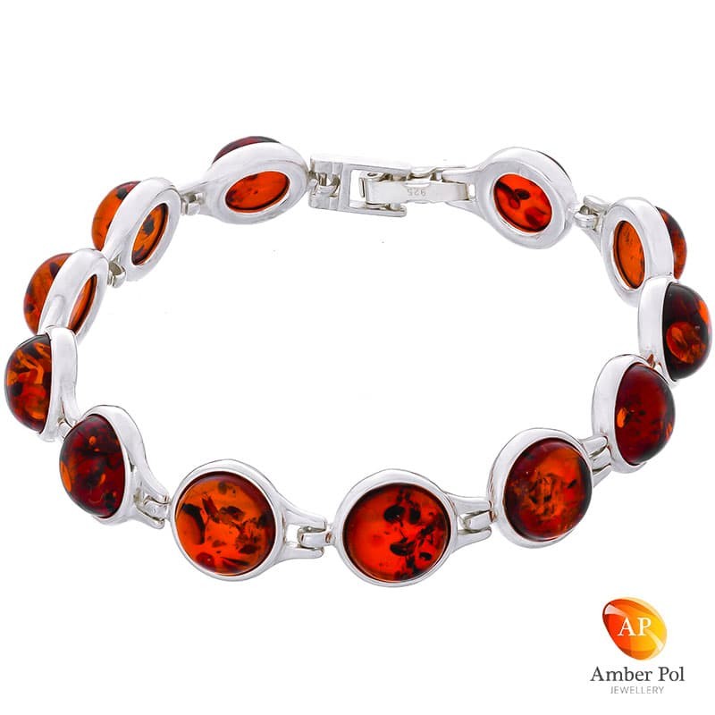 Piękna bransoletka ze srebra próby 925 składająca się z 12 elementów z koniakowymi okrągłymi bursztynami.