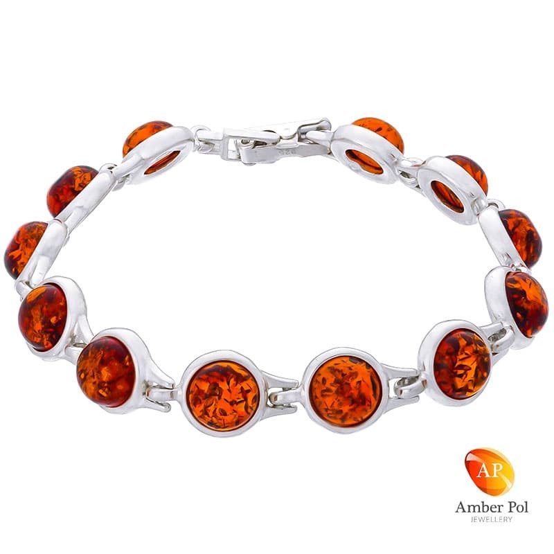 Piękna bransoletka ze srebra próby 925 składająca się z 12 elementów z koniakowymi okrągłymi bursztynami.