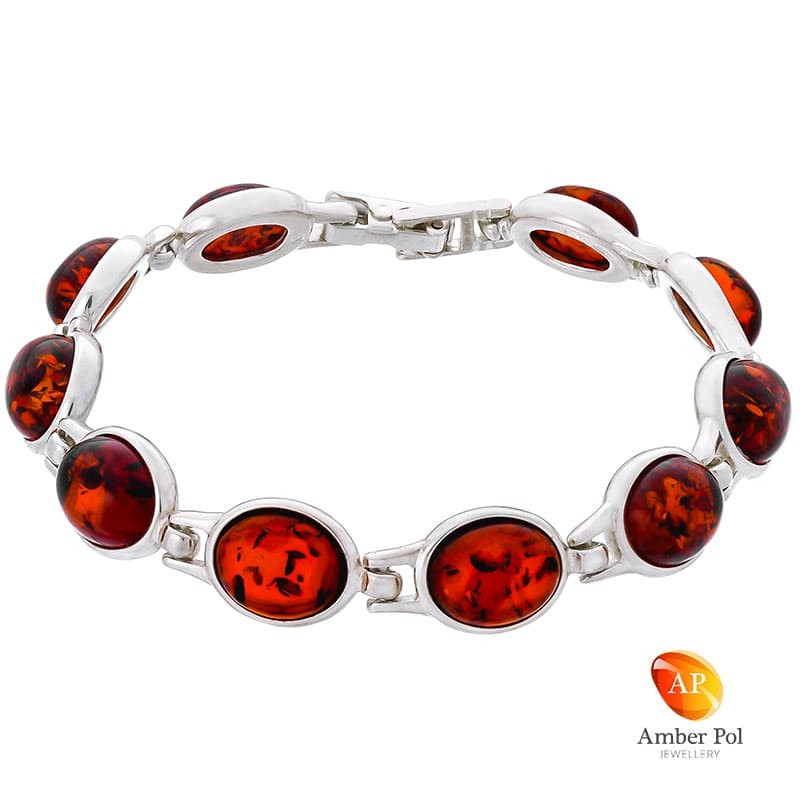 Piękna bransoletka ze srebra próby 925 składająca się z 10 elementów z owalnymi bursztynami w kolorze koniakowym.