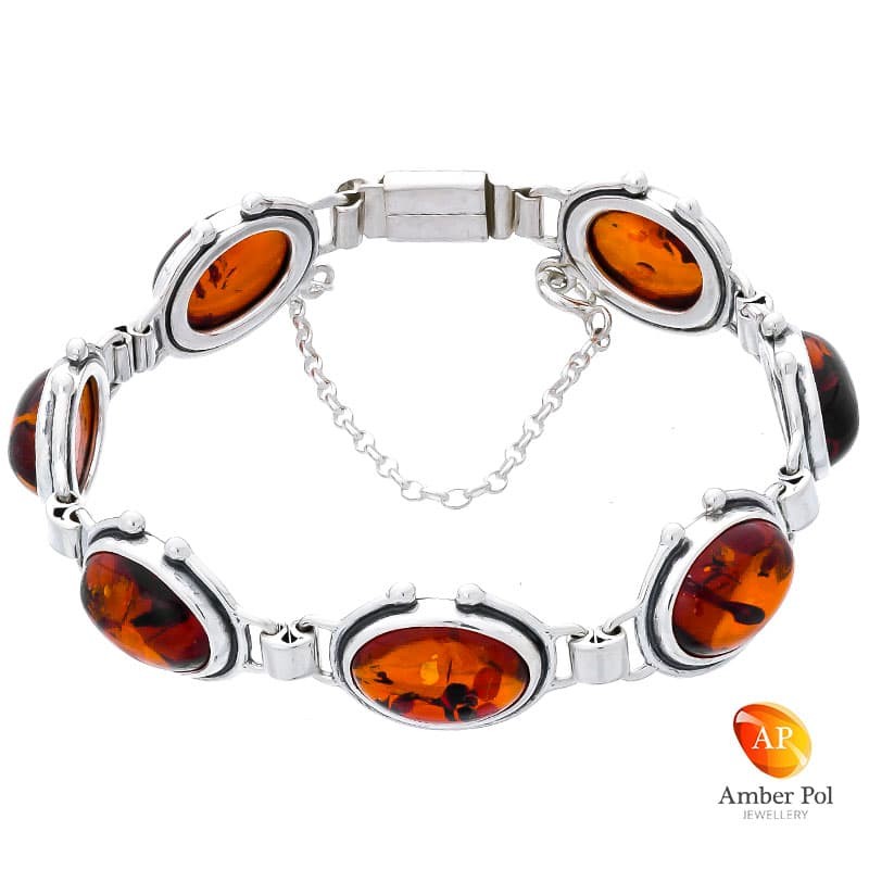 Piękna srebrna bransoletka próby 925 z 8 elementami i koniakowymi bursztynami ręcznie zakutymi.