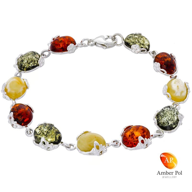 Piękna srebrna bransoletka próby 925 z 11 elementami i owalnymi  bursztynami w kolorze mix. Zdobiona ażurkami.