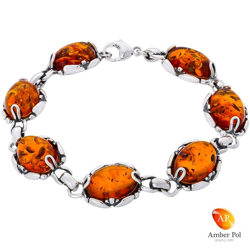 Bransoletka ze srebra próby 925 z naturalnym bursztynem w koniakowym kolorze.