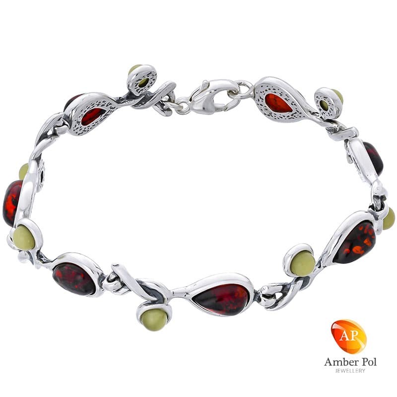 Bransoletka srebrna 925 z bursztynem koniakowym i mlecznym. Posiada 7 elementów a w każdym po 2 bursztynki.