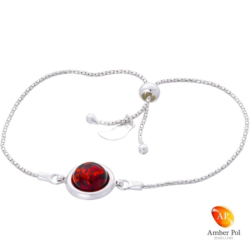 Bransoletka srebrna 925 ściągana i regulowana z bursztynem w koniakowym kolorze.