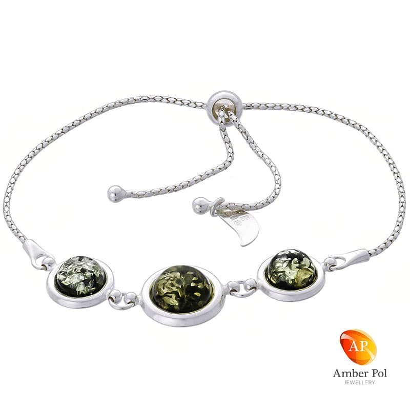 Bransoletka srebrna 925 ściągana i regulowana z  trzema okrągłymi bursztynami  w zielonym  kolorze.
